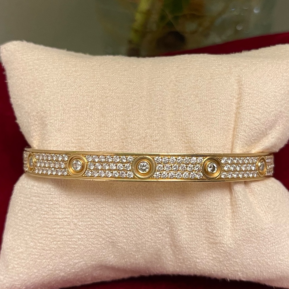 Size 21, measures 8” Cartier style 18k solid gold bracelet.
